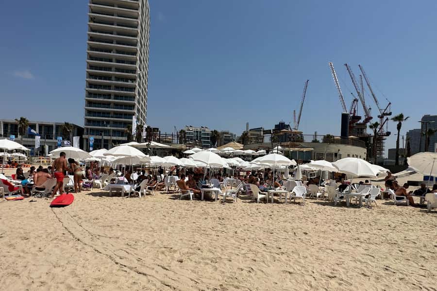 Tel Aviv: Professional Surfing Lessons at Beach Club TLV - Entering the Water and Catching Your First Ride